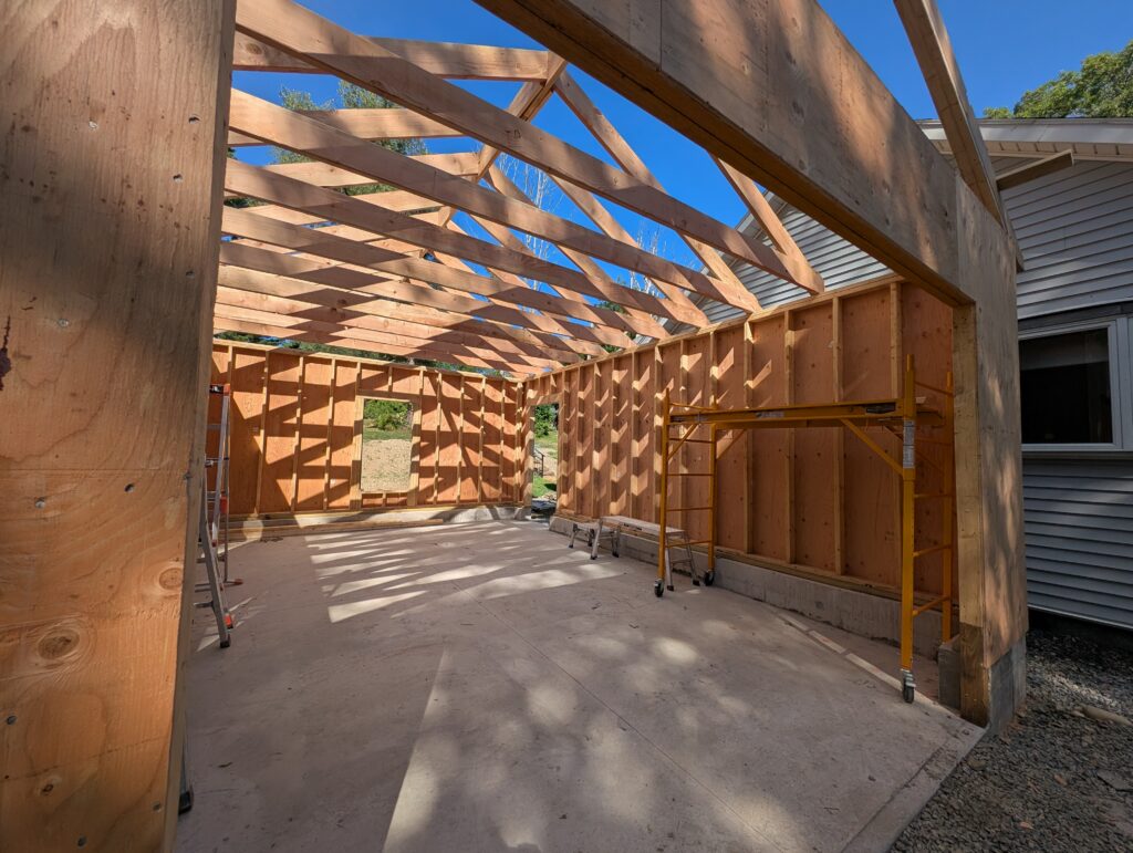 Wall and roof framing during construction of the lakeside garage addition.