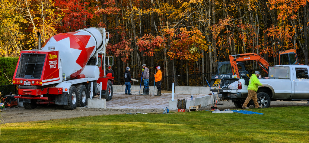 Four-foot frost-wall foundation and concrete slab under construction for the detached carriage house