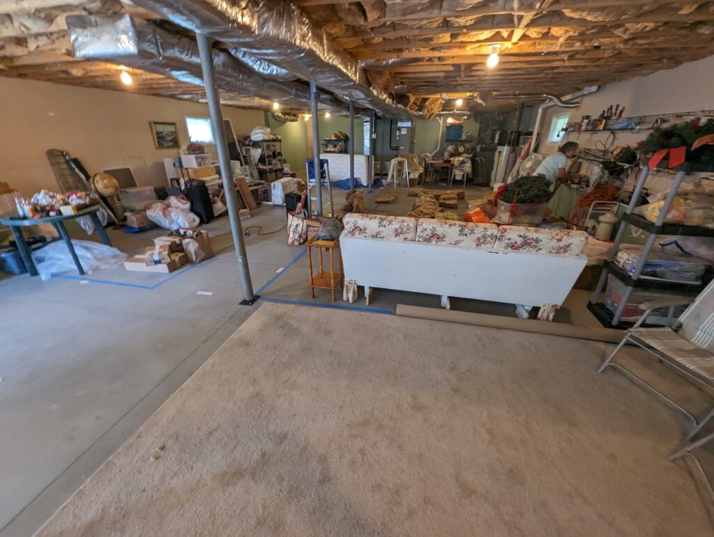Unfinished lower level before conversion into an approximately 800-square-foot apartment